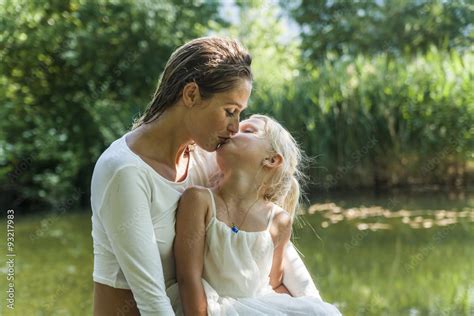 Mother Kissing Daughter